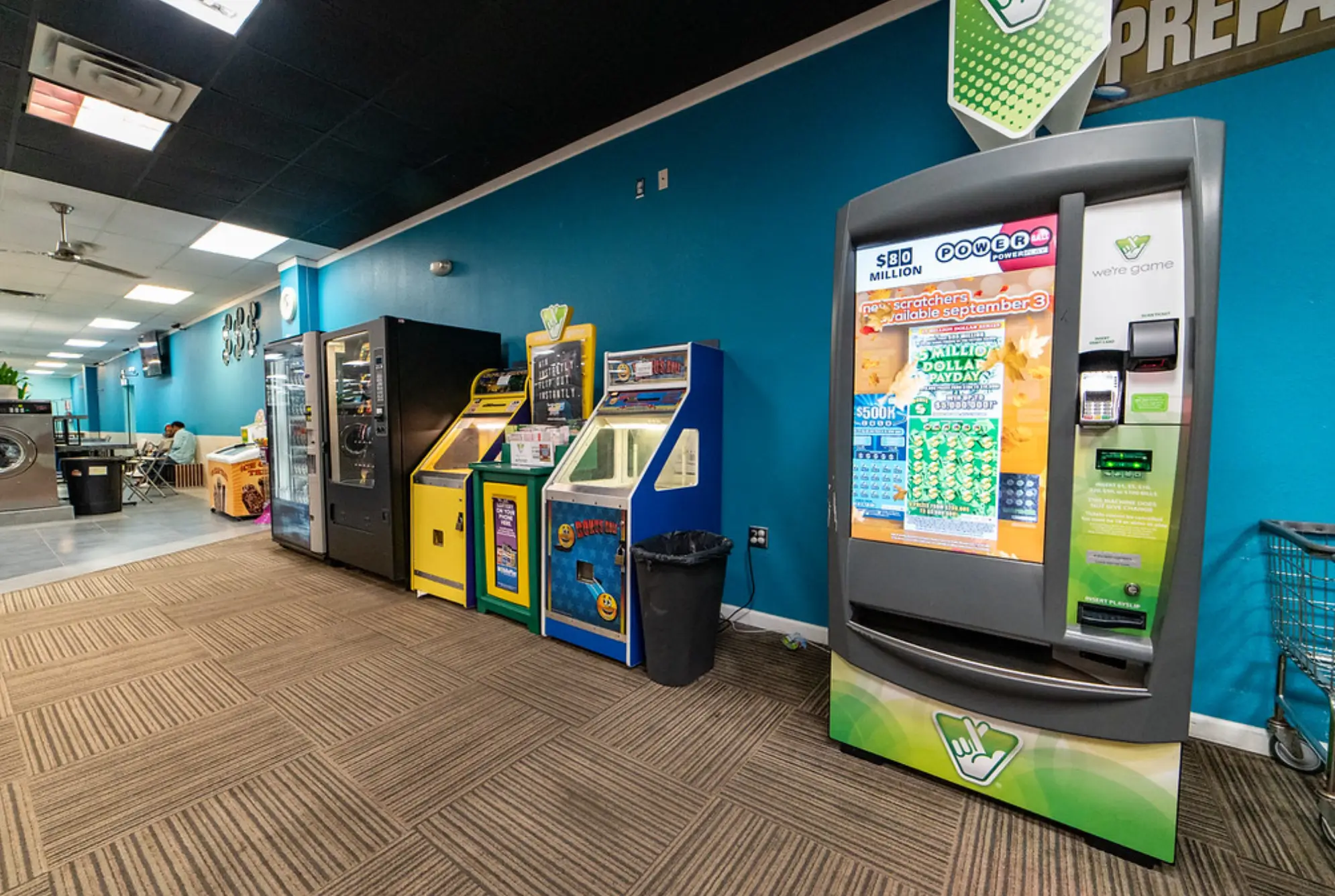 Arcade games section for customer entertainment at Rose Hill Wash