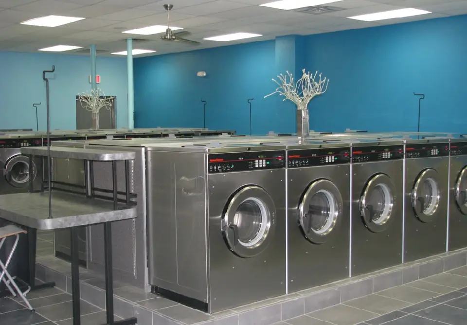 Spacious laundry folding tables at Rose Hill Wash laundromat