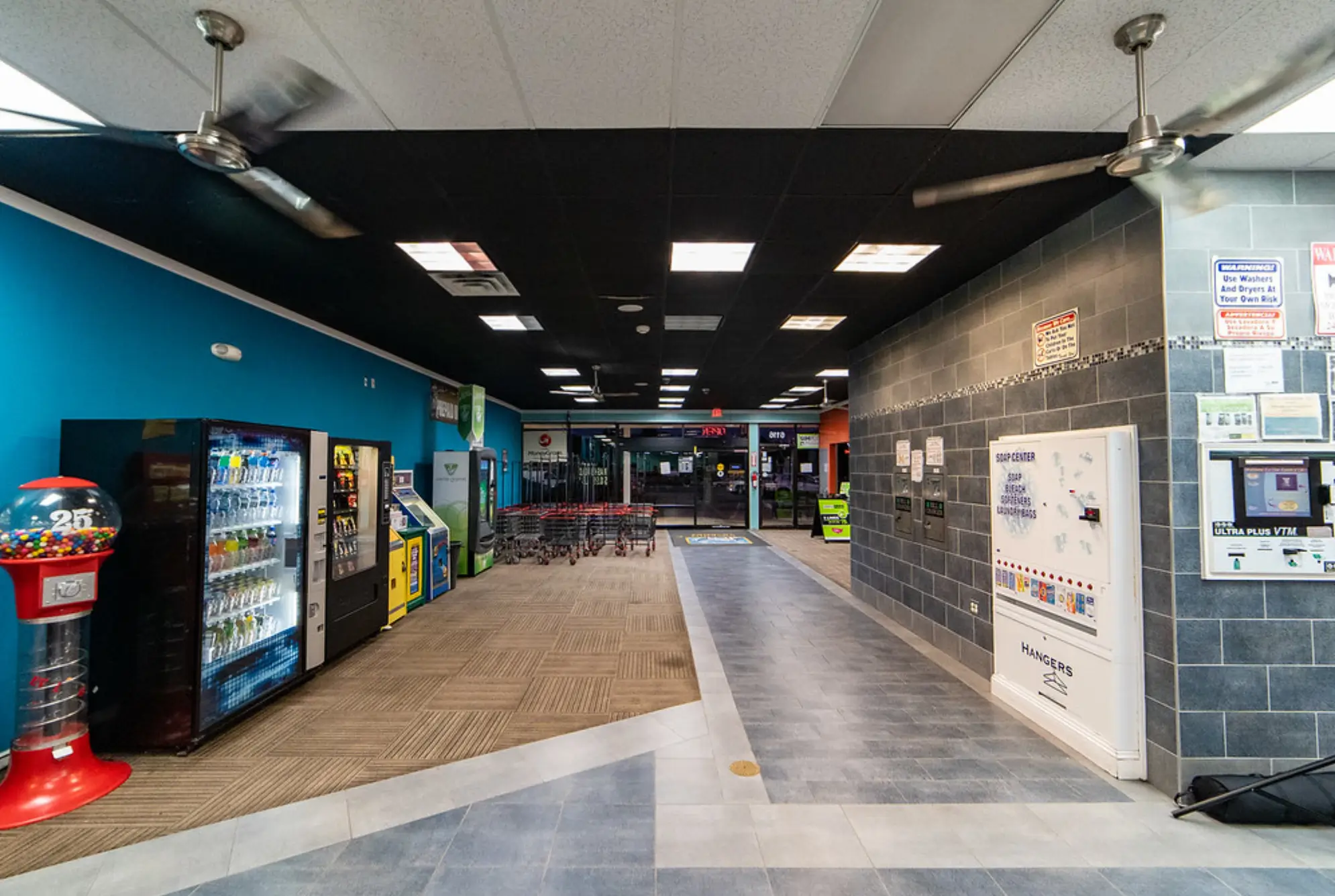 Game room and entertainment space inside Rose Hill Wash laundromat