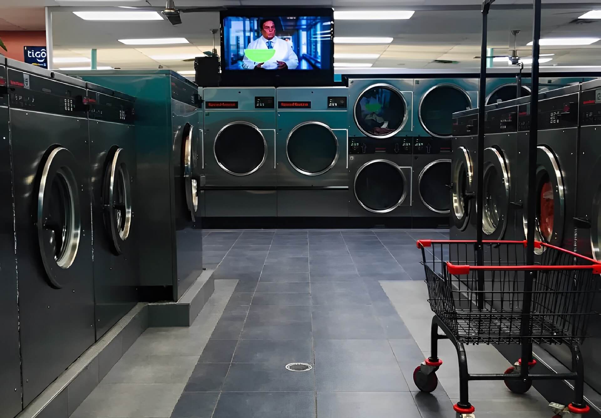 Interior view of washing and drying machines at Rose Hill Wash
